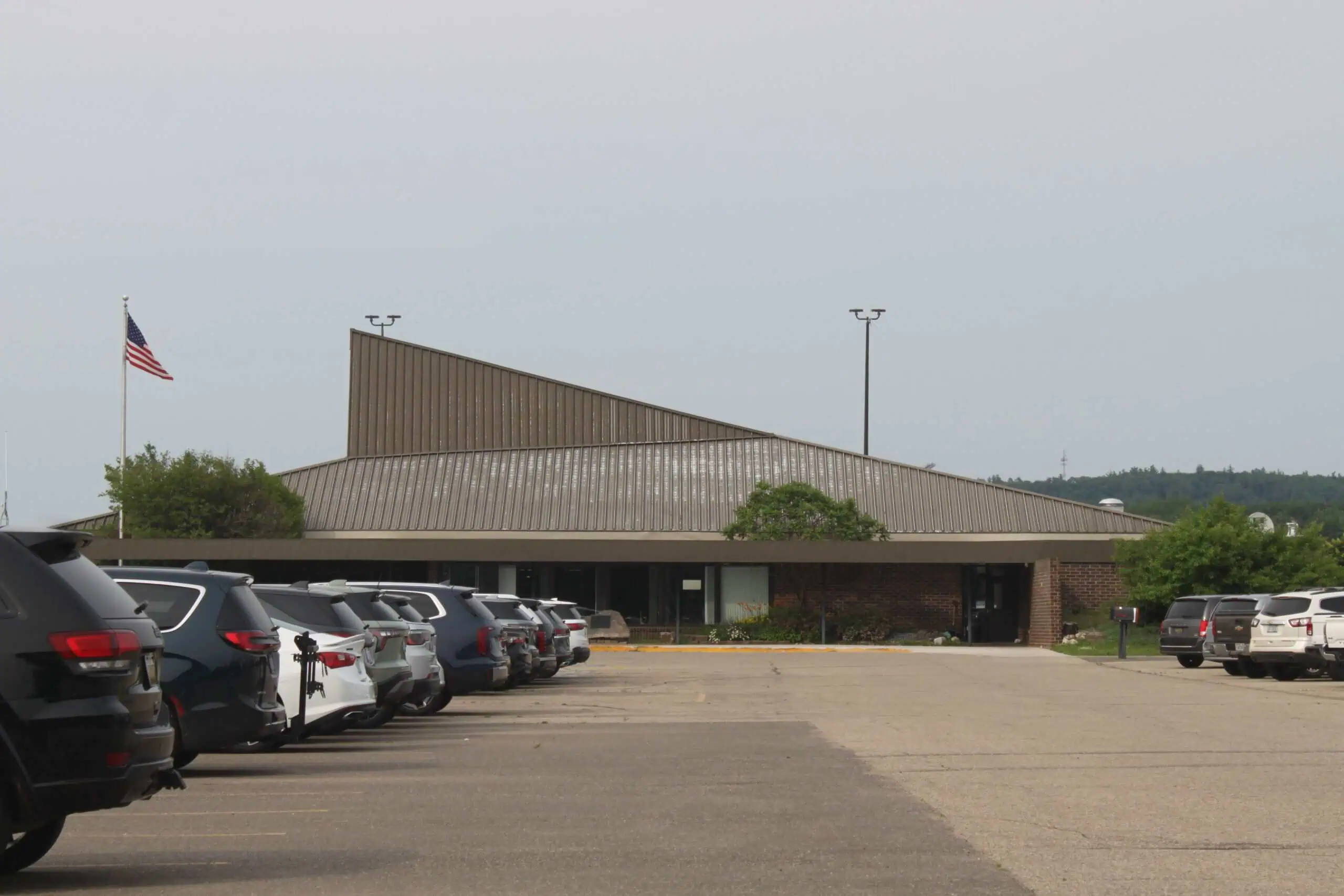 Ford Airport terminal exterior and parking area in Iron Mountain, Michigan.