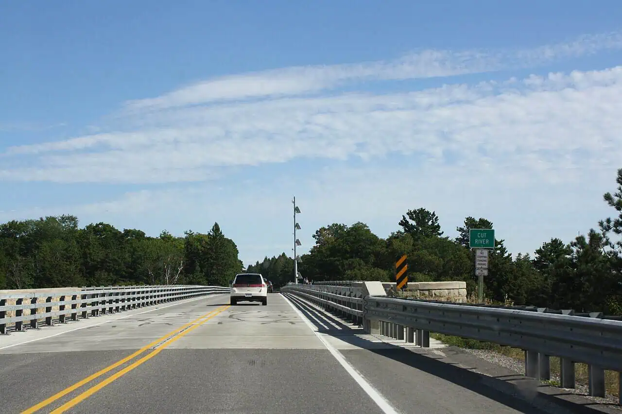 Drivers Cross 147 Feet of Thin Air on US-2. Under the Bridge, a Door Says T. Troll.