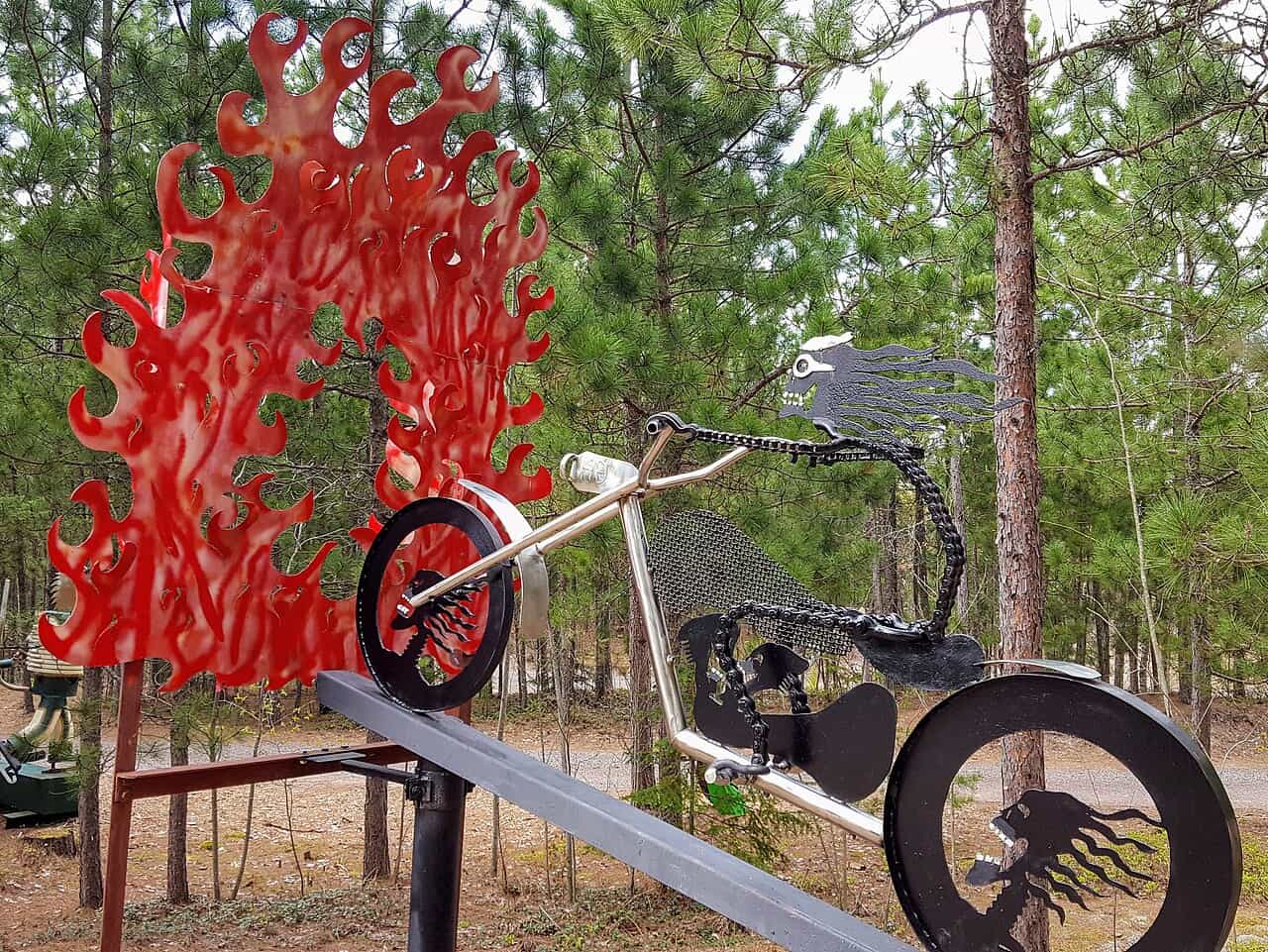 A skeleton riding a motorcycle, welded from scrap iron, on display at Lakenenland near Marquette, Michigan.
