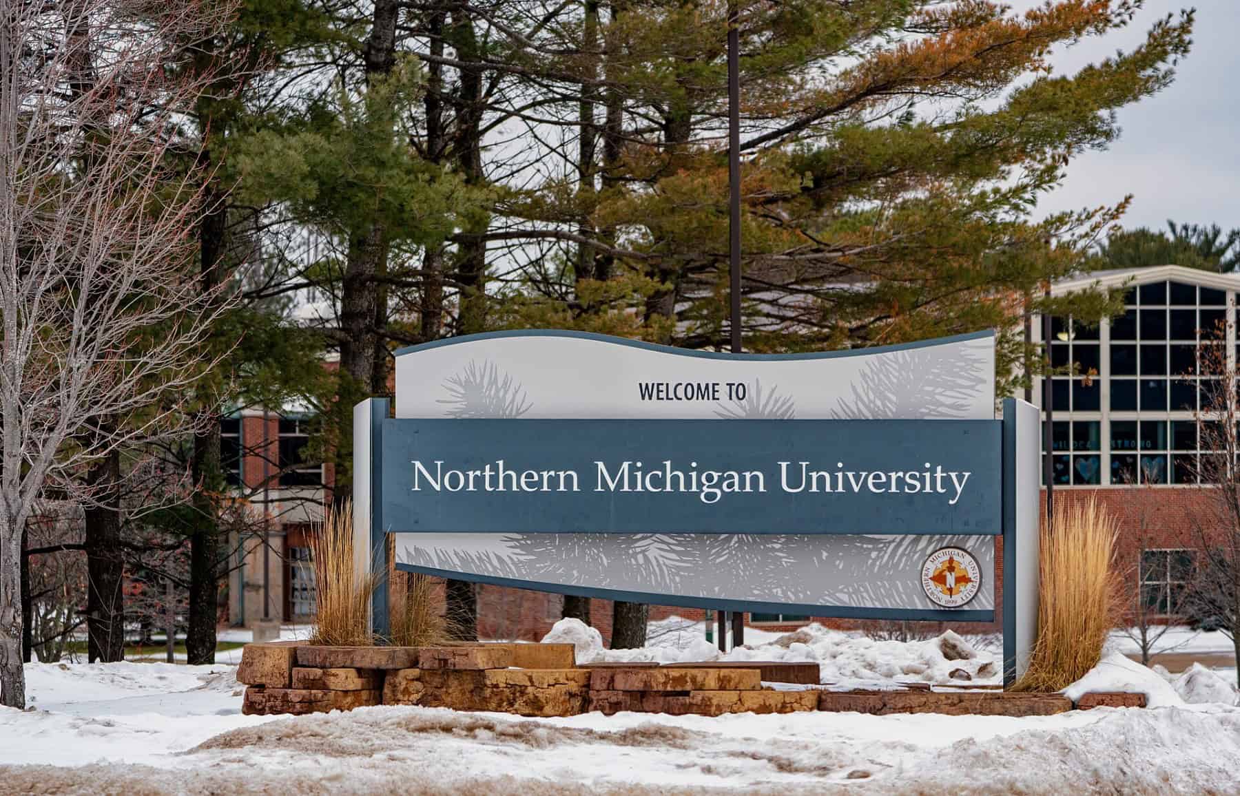 A Welcome to Northern Michigan University sign on the Marquette campus in winter. Photo: Tony Webster, CC BY 2.0.